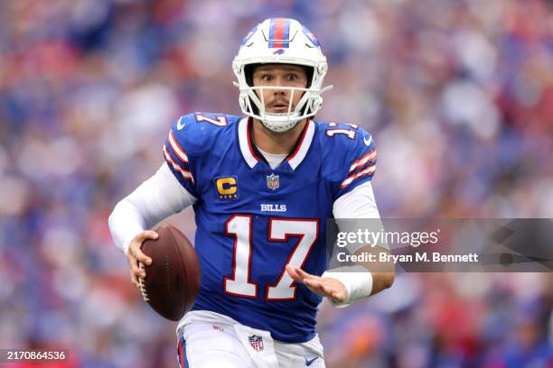 Josh Allen of the Buffalo Bills scrambles for a touchdown during the fourth quarter against the Arizona Cardinals at Highmark Stadium on September...