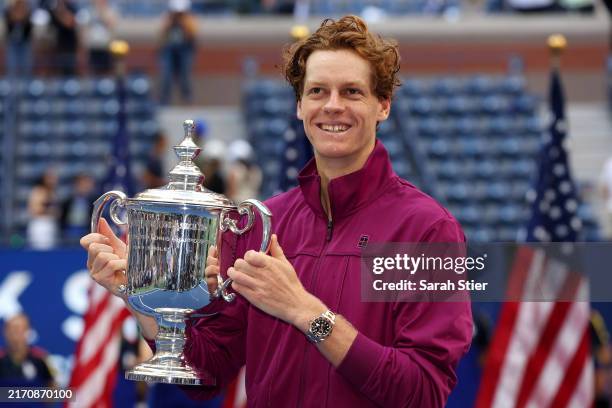 Jannik Sinner of Italy celebrates with the winners trophy after defeating Taylor Fritz of the United States to win the Men's Singles Final on Day...