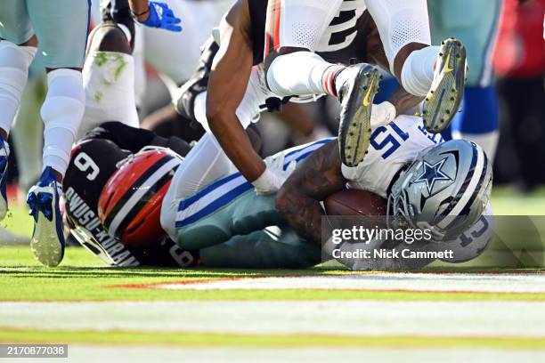 Ezekiel Elliott of the Dallas Cowboys scores a touchdown in the second quarter of the game against the Cleveland Browns at Cleveland Browns Stadium...