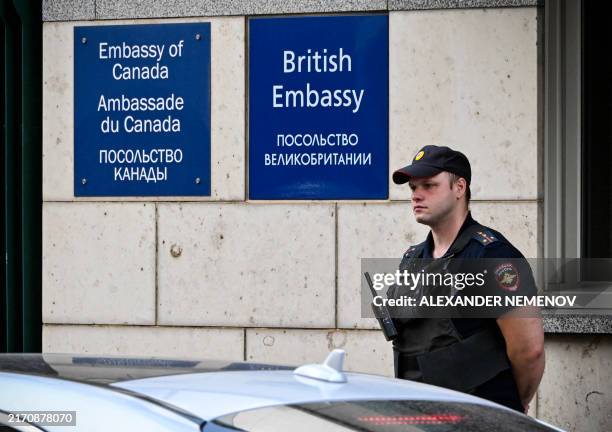 Russian police officer patrols outside the British embassy building in Moscow on September 13, 2024. Russia's FSB security service on September 13,...