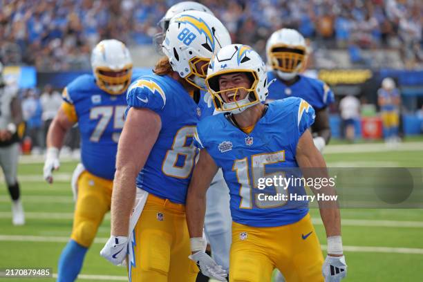 Hayden Hurst and Ladd McConkey of the Los Angeles Chargers celebrate after McConkey's receiving touchdown during the fourth quarter against the Las...