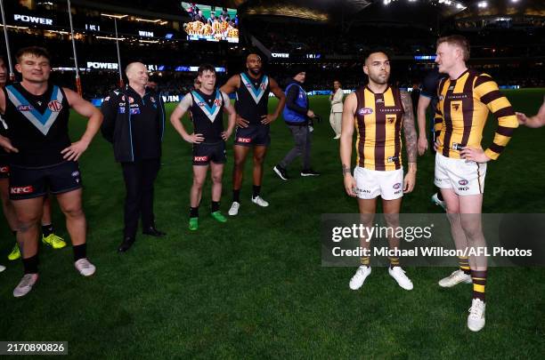 Ken Hinkley, Senior Coach of the Power exchanges words with Hawthorn players during the 2024 AFL Second Semi Final match between the Port Adelaide...