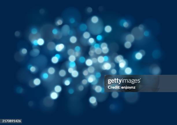 sparkling glittering winter christmas light vector illustration on blue background - twinkle lights background stock illustrations