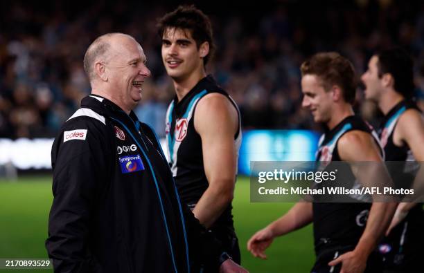 Ken Hinkley, Senior Coach of the Power exchanges words with Hawthorn players after the 2024 AFL Second Semi Final match between the Port Adelaide...