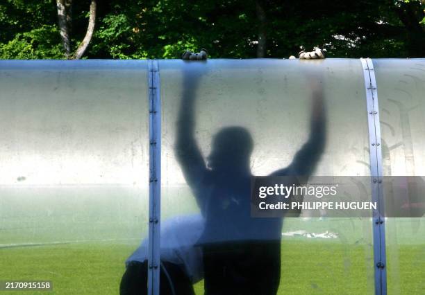Togolese goalkeeper Kossi Agassa stretches during a training session, 07 June 2006 in Wangen stadion, Germany. Togo will play with France,...