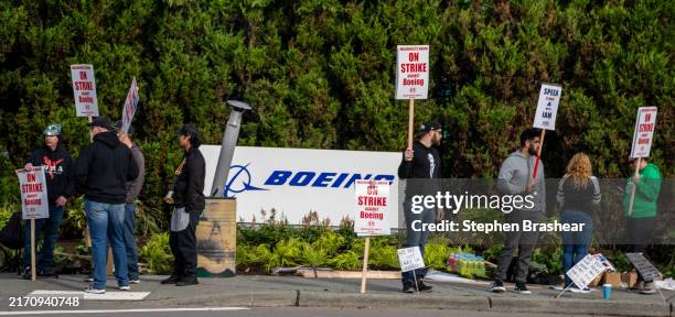 Boeing Machinists union members picket outside a Boeing factory on September 13, 2024 in Renton, Washington. The union voted overwhelmingly to reject...