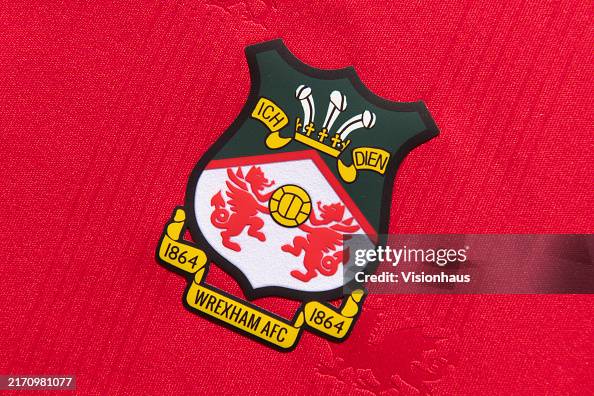 The Official Club Badge Of Wrexham AFC On A Home Shirt On September the-official-club-badge-of-wrexham-afc-on-a-home-shirt-on-september