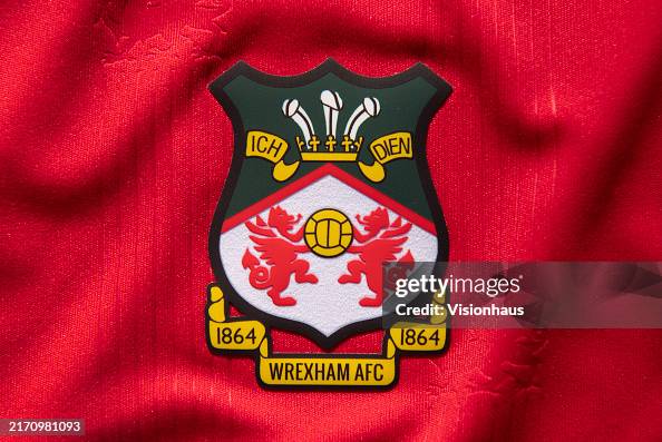 The Official Club Badge Of Wrexham AFC On A Home Shirt On September the-official-club-badge-of-wrexham-afc-on-a-home-shirt-on-september