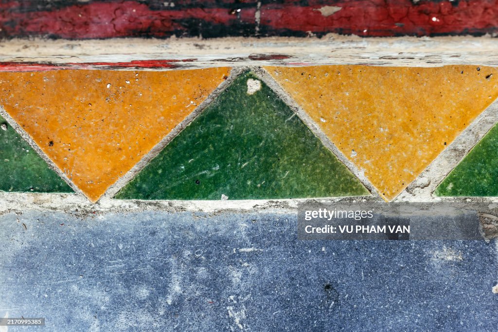 Triangular yellow tiles on floor