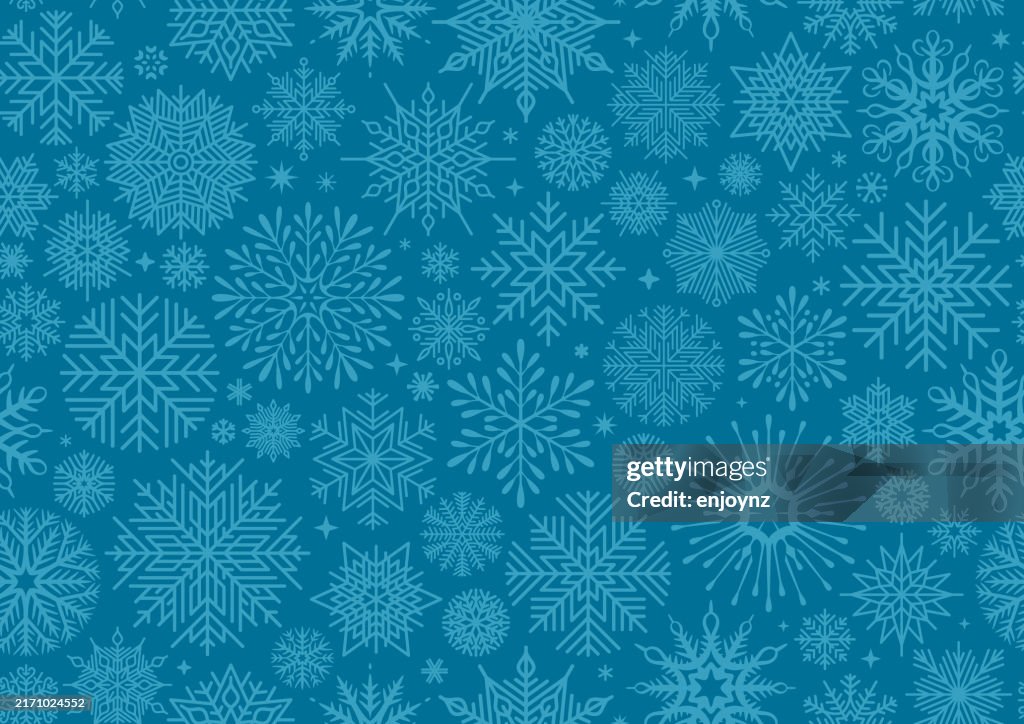 Seamless blue Christmas winter snowflakes wallpaper design