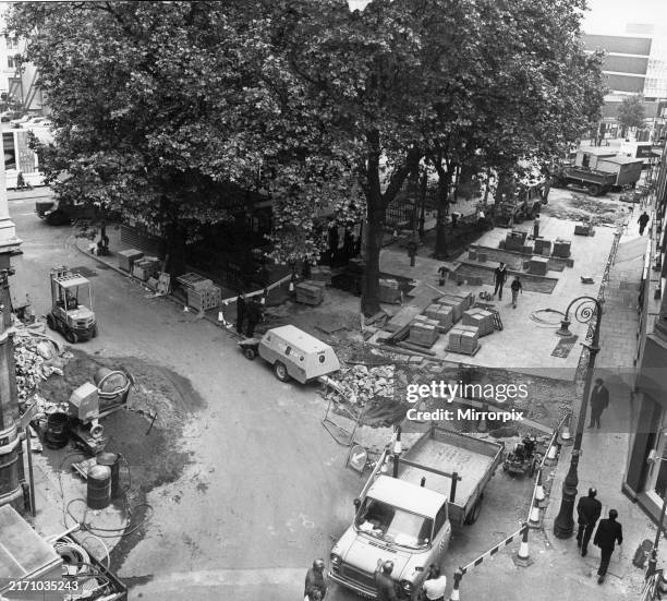 Paving stones being laid on the pedestrianised area of The Hayes,Cardiff city centre. 7th June 1976.