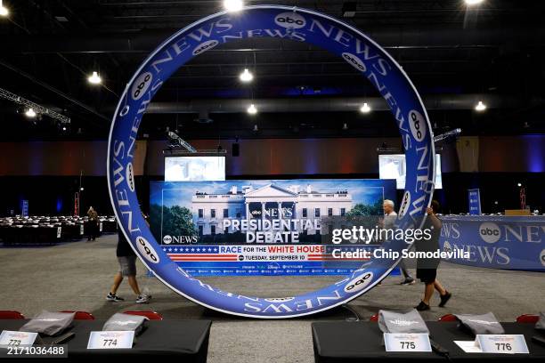 News signage is installed in the media file center inside the Pennsylvania Convention Center one day before the presidential debate on September 09,...