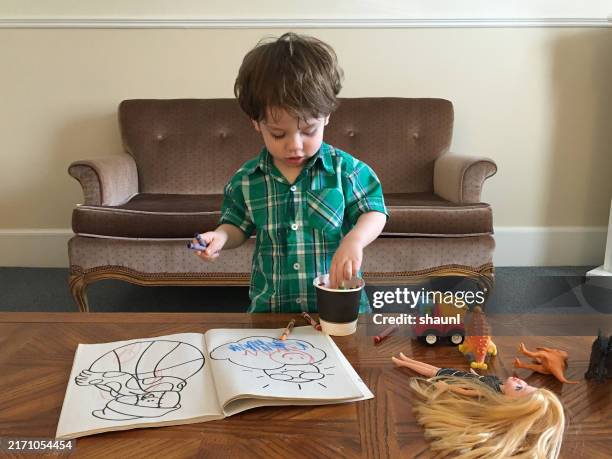 boy plays with crayons - crayon drawing stock pictures, royalty-free photos & images