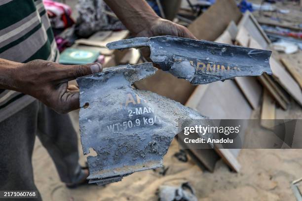 Man shows remains of ammunition were found in the area following Israeli army hit Palestinian tents in al-Mawasi area, Khan Yunis, Gaza The tents...