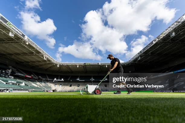 The greenkeeper prepares the pitch ahead of the Bundesliga match between Borussia Moenchengladbach and VfB Stuttgart at Borussia-Park on September...
