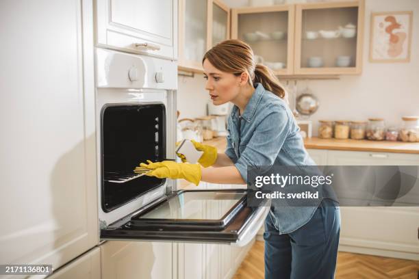 cleaning service - clean oven stock pictures, royalty-free photos & images