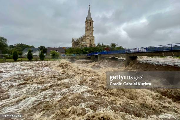 Torrent of water flows along the river Bela during heavy rain on September 14, 2024 in Mikulovice, Czech Republic.There have been extreme weather and...