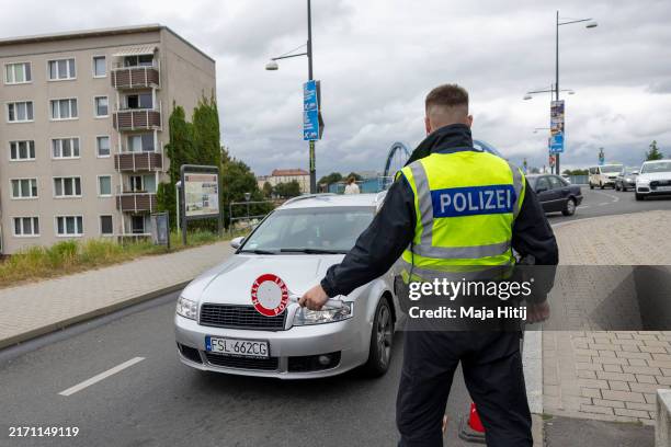 German federal police stops car arriving at the German-Polish border for a check on September 10, 2024 in Frankfurt an der Oder, Germany. German...