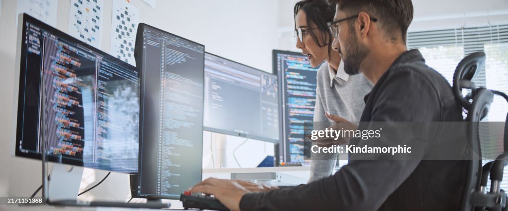 Hispanic Latin American couple, software engineer developer use computer, work on program coding together at home office. Programming language development technology, freelance job concept