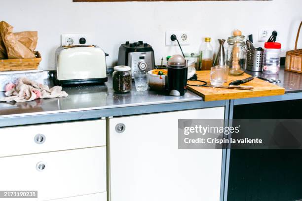 messy kitchen countertops covered in clutter - cluttered stock pictures, royalty-free photos & images
