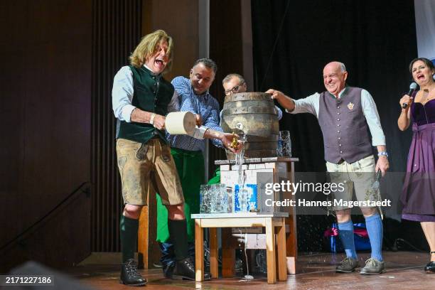 Jürgen Drews, Axel Munz and Angela Ascher attend the Angermaier Trachten Night on September 10, 2024 in Munich, Germany.