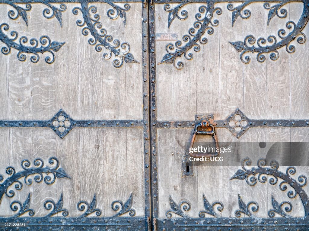 Ancient wood and iron door of St Helens Church, Abingdon