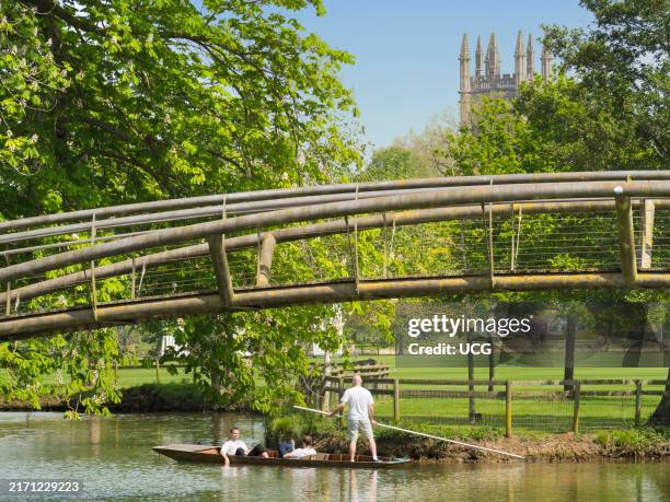 Punts below footbridge over the river Cherwell in Oxford.