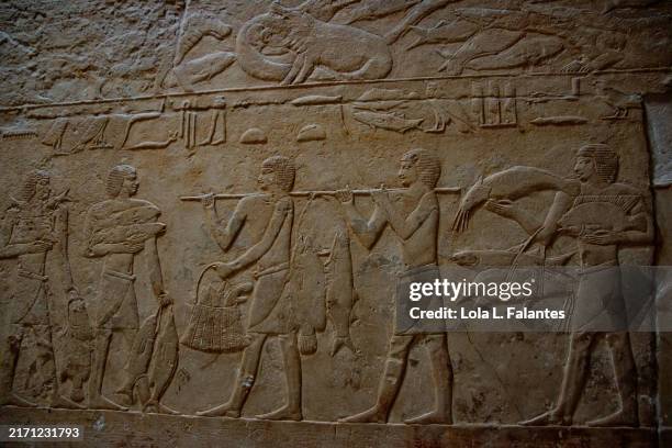 ancient egyptian bas-relief depicting offerings. necropolis of the old kingdom, saqqara, egypt - saqqara stock pictures, royalty-free photos & images