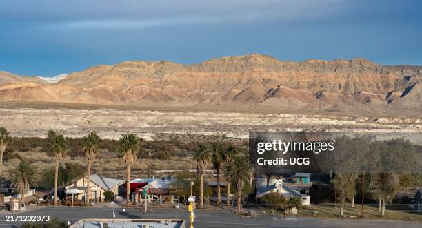 Shoshone, California with Tecopa Lake beds in middle ground and Resting Spring Range in background,.