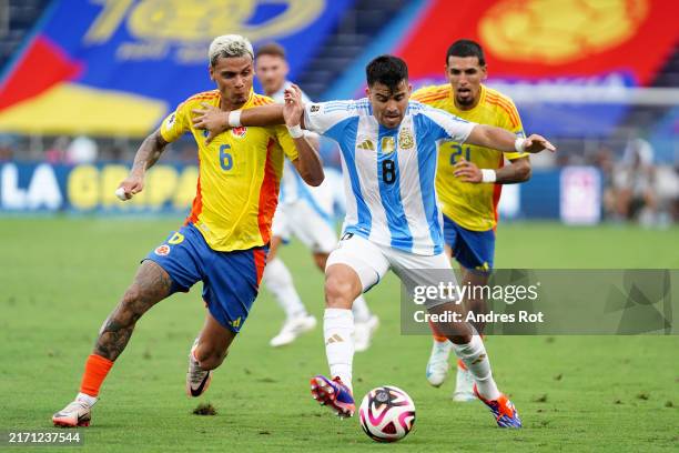 Marcos Acuña of Argentina and Richard Rios of Colombia battle for the ball during the South American FIFA World Cup 2026 Qualifier match between...