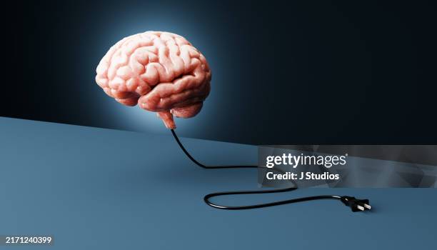 hovering brain with an unplugged power cord - electrical plug stock pictures, royalty-free photos & images