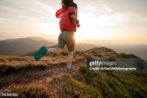 woman running on mountain trail, trail running. - cross country running stock pictures, royalty-free photos & images