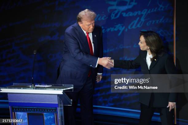 Republican presidential nominee, former U.S. President Donald Trump and Democratic presidential nominee, U.S. Vice President Kamala Harris greet as...
