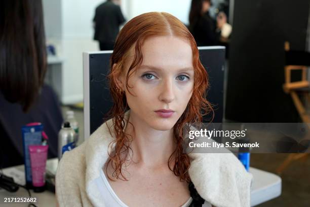 Model prepares backstage at the Juzui SS25 Collection fashion show during the September 2024 New York Fashion Week: The Shows at Canoe Studios on...