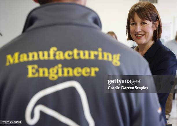 Britain's Chancellor of the Exchequer Rachel Reeves speaks to students during a visit to Silverstone University Technical College at Silverstone...