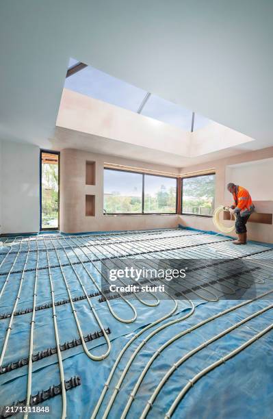 underfloor heating installation - heating engineer stock pictures, royalty-free photos & images