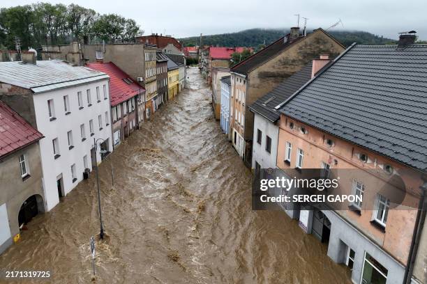 This aerial photograph taken on September 15, 2024 shows a view of the flooded streets in Glucholazy, southern Poland. One person has drowned in...