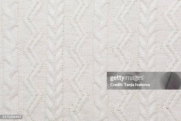 textured smooth knitted white pattern sweater background - sweater stock pictures, royalty-free photos & images