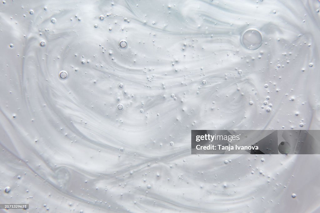 Texture of gel cream or serum with bubbles. Lotion, moisturizer, skin care background