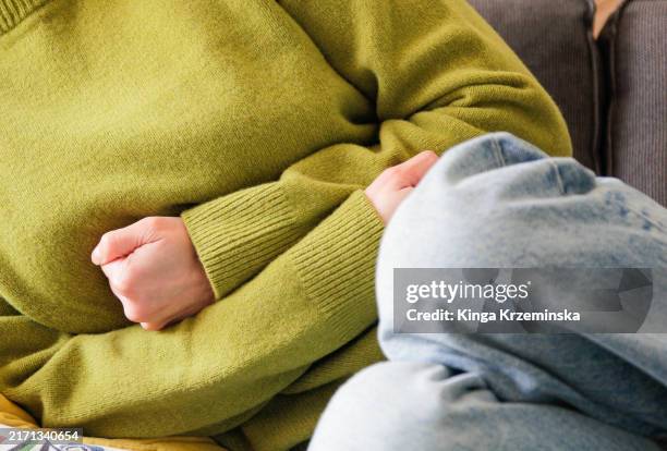 stomachache - endometriosis stock pictures, royalty-free photos & images