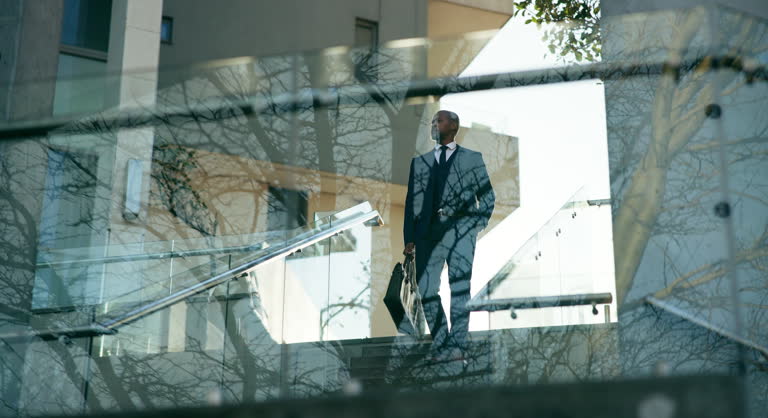 https://media.gettyimages.com/id/2171348860/video/outdoor-walking-and-black-man-on-stairs-for-business-commute-to-law-firm-or-court-in-city.jpg?b=1&s=640x640&k=20&c=-M2zu-0zH-LpbhWGJRonz9aA8X2IJJck97xS-zrUGBw=