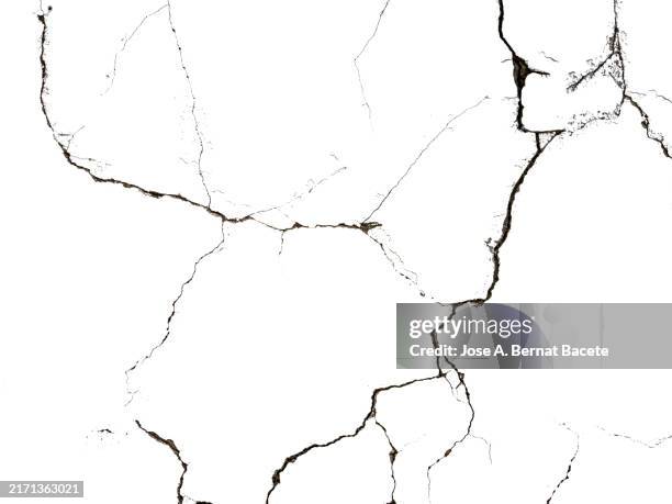 deep cracks in a smooth white surface. - gebrochen stock-fotos und bilder