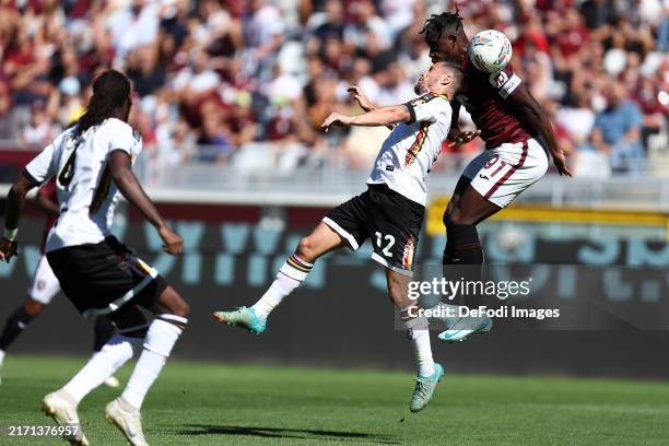 Turin, Italy Duvan Zapata of Torino Fc and Rares Burnete of Us Lecce battle for the ball during the Serie A match between Torino and Lecce at...