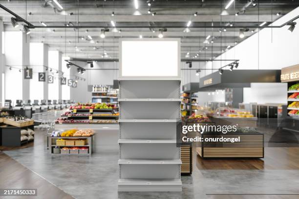 close-up of empty rack and billboard in supermarket with blurred background - butiksskyltning bildbanksfoton och bilder