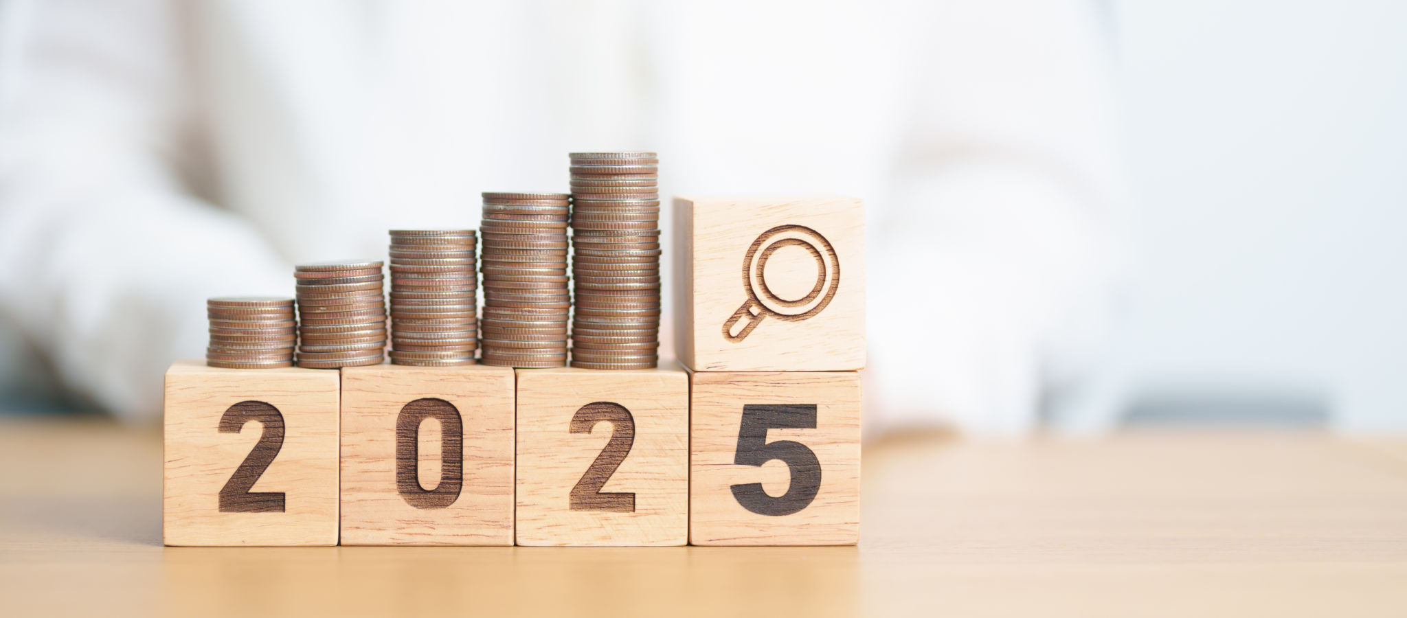 Happy New Year 2025 with coins money stack growing with magnifier glass. Money saving, Inflation, tax, cash flow, Job search, hiring and research development concepts Happy New Year 2025 with coins money stack growing with magnifier glass. Money saving, Inflation, tax, cash flow, Job search, hiring and research development concepts