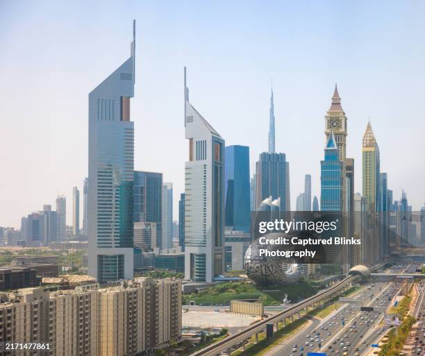 aerial view of dubai's city skyline on a cloudy day - dubai marina stock pictures, royalty-free photos & images