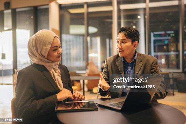 business partners discuss commercial deal, contract details at formal meeting - obedience stock pictures, royalty-free photos & images