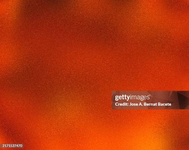 close-up of a smooth rough textured plastic sheet on a red background. - desastre ambiental imagens e fotografias de stock