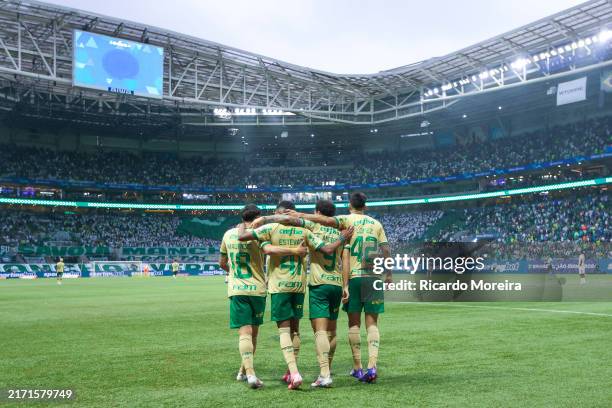Estevao of Palmeiras celebrates with teammates after scoring the fourth goal of his team during the Brasileirao 2024 match between Palmeiras and...