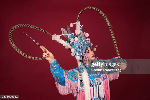 a beijing opera actress is performing on stage - chinese theatre and the actor in performance stock pictures, royalty-free photos & images